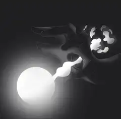 Hand blowing a glowing orb