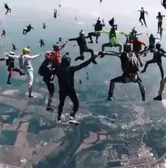 Skydivers forming a circle in freefall