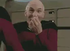 Captain Picard chuckling and smiling