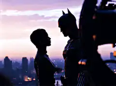 Catwoman touches Batman's face