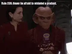 Quark raises a glass with text