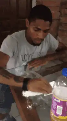 Man sneezes into white powder