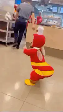 Toddler in KFC chicken costume dancing