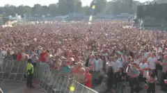 Crowd at outdoor concert with confetti