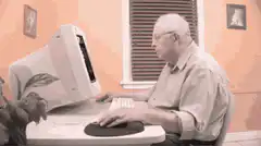 Old man confused by computer
