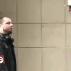 Man in swastika jacket gets punched