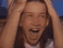 Girl screaming and throwing hands up