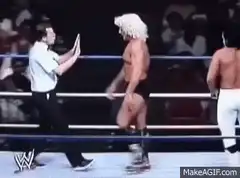 Wrestler gets slapped and knocked down