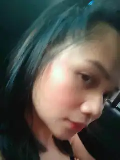 woman with blue hair looking down