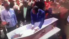 Man sits up in coffin