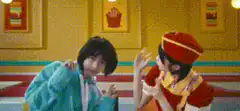 Two girls dancing in a fast food restaurant
