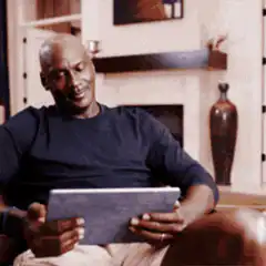 Michael Jordan laughing at tablet