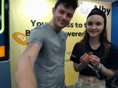 Couple at Bitcoin Alby booth