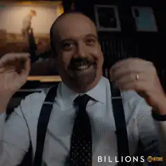 Paul Giamatti smiling with fists up