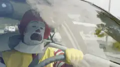 Ronald McDonald crying in car