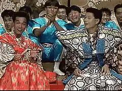 Japanese men in colorful kimonos laughing