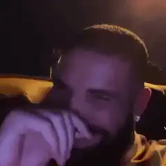 Drake laughing in a car
