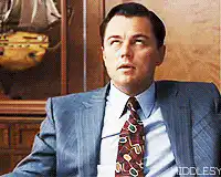 Leonardo DiCaprio coughing in a suit