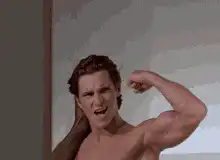 Christian Bale flexing muscles