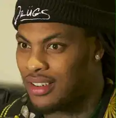 Man in beanie with shocked expression