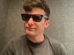 man in sunglasses smirking