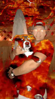 man holding dog in fire
