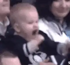 Baby cheering at hockey game