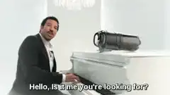 Man playing piano with camera