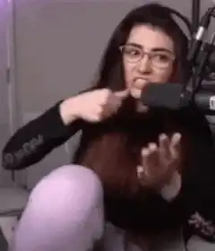 woman pointing at herself then gesturing