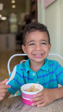 smiling boy eating ice cream