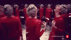 Ruth Negga dancing in red dress