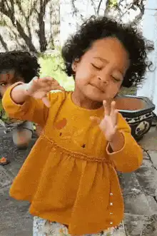 Toddler dancing with chicken