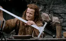 Blacksmith hammering a sword