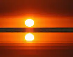 Sunset over calm water