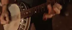 Close up of hands playing banjo