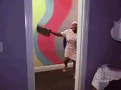 Woman dancing with buckets in doorway