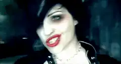 goth girl with red lips smiles