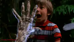 boy screaming at zombie hand