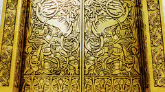 Golden carved doors with intricate patterns