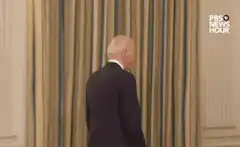 Joe Biden turns and smiles