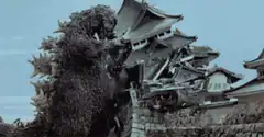 Godzilla destroys a traditional Japanese building