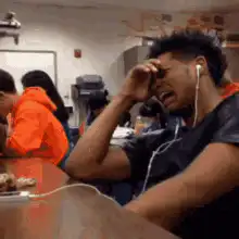 Man crying while listening to music
