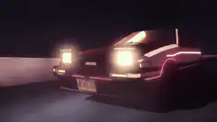 DeLorean driving at night