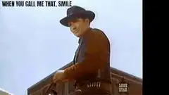 Man in hat smiles and tips hat