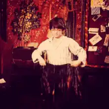 Child dancing with a scarf