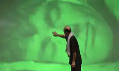 Man reaching for green screen