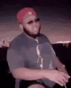 Two men doing a complex handshake