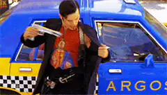 El Mariachi draws guns from jacket