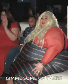 Blonde woman in red top and striped skirt dancing