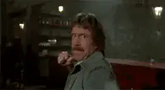 Chuck Norris points finger then punches